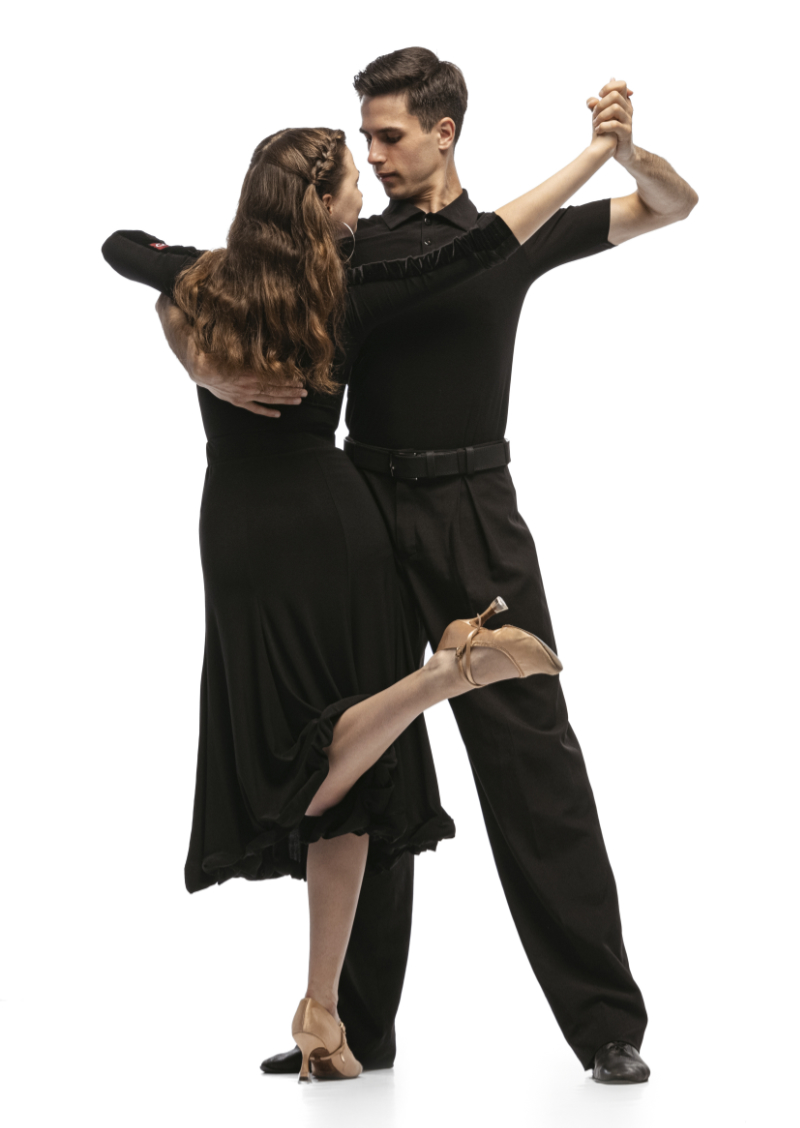Dynamic portrait of young emotive dancers in black outfits dancing ballroom dance isolated on white background. Concept of art, beauty, music, style. Argentine tango dancers